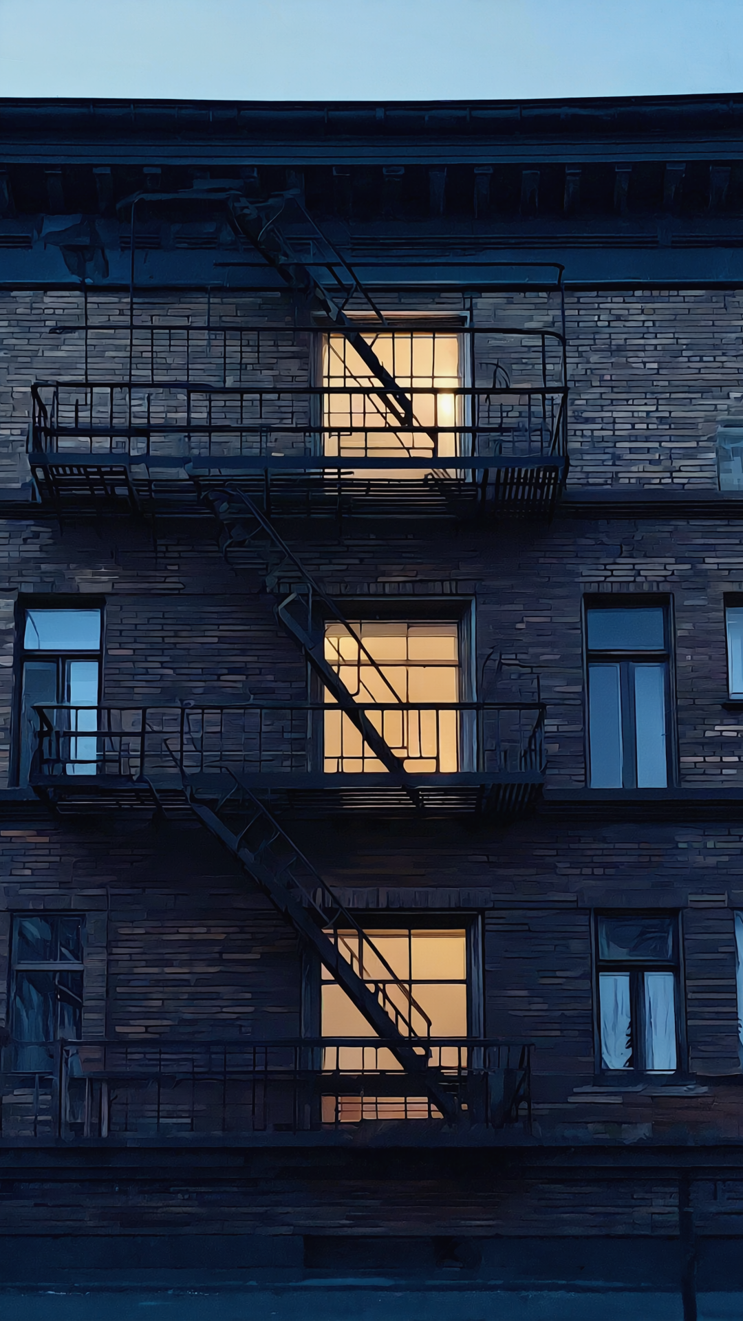 Three illuminated windows, one above another, across a nighttime facade.